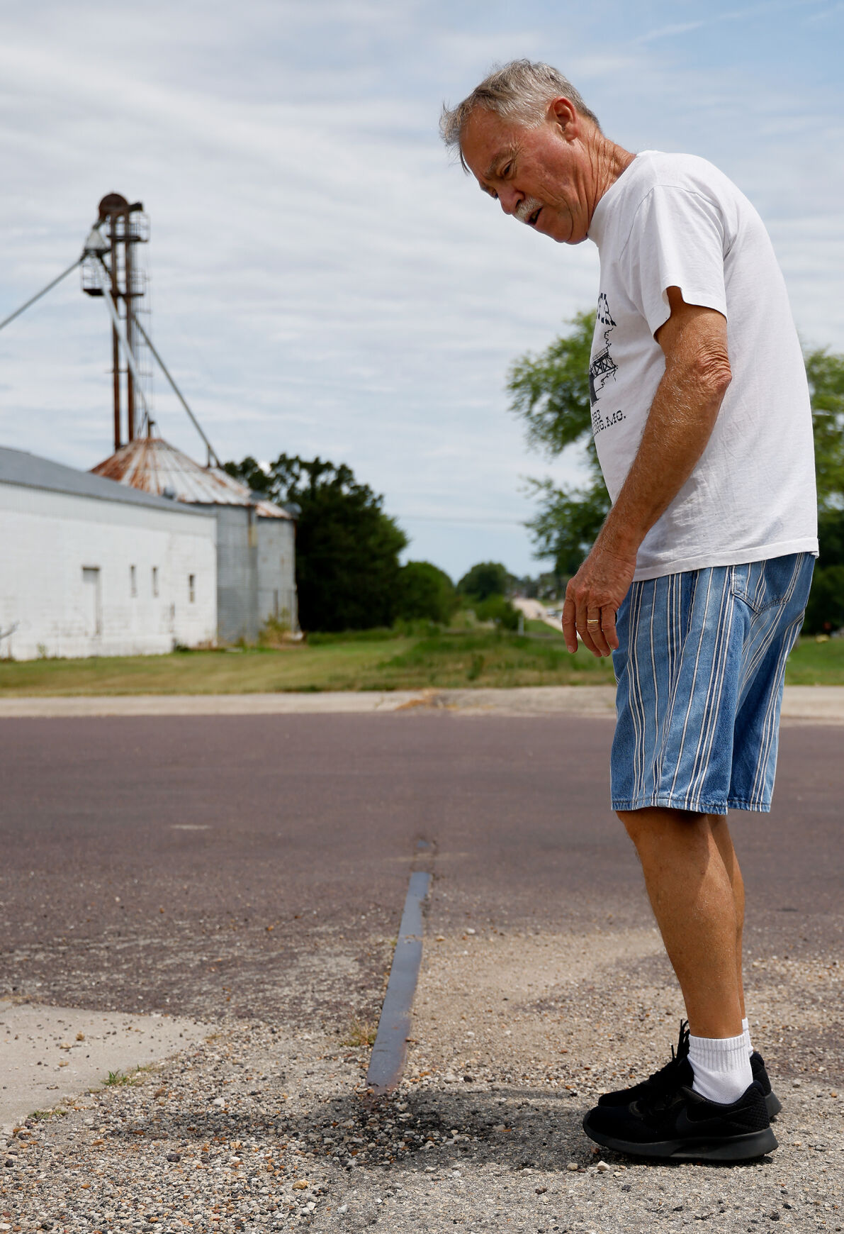 Mark Schaeperkoetter shows how the old railroad were cut and buried